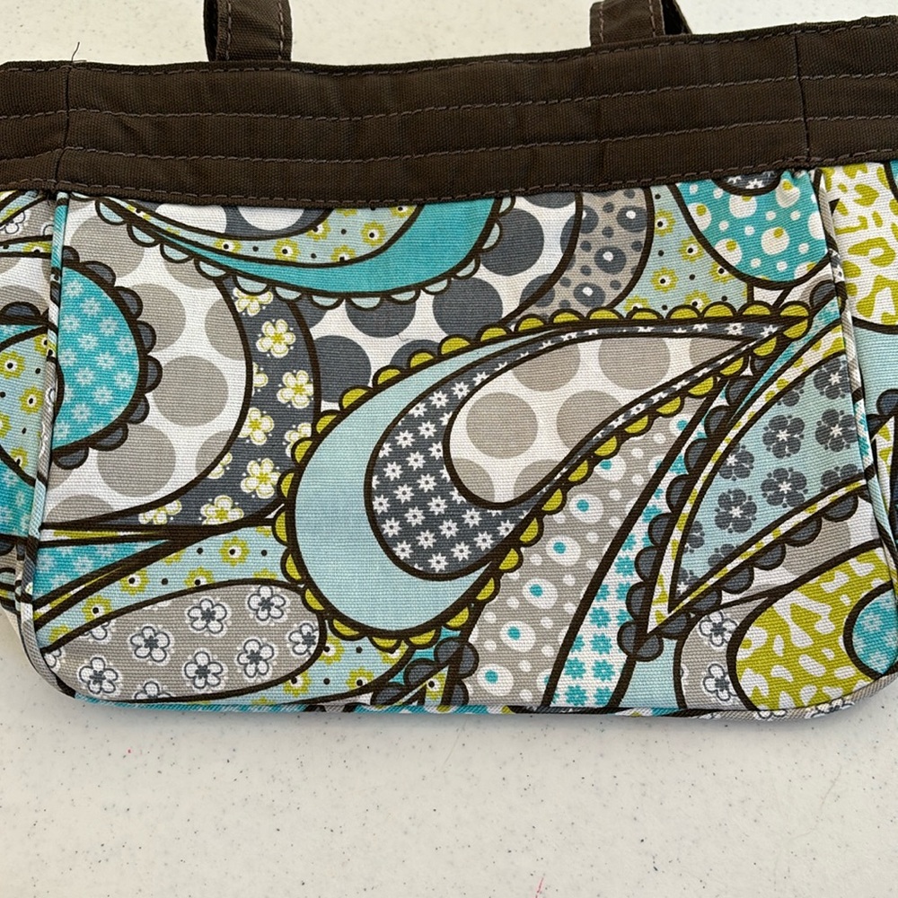 Thirty-one purse. Paisley w/brown trim & straps. Brown/white pinstripe lining.